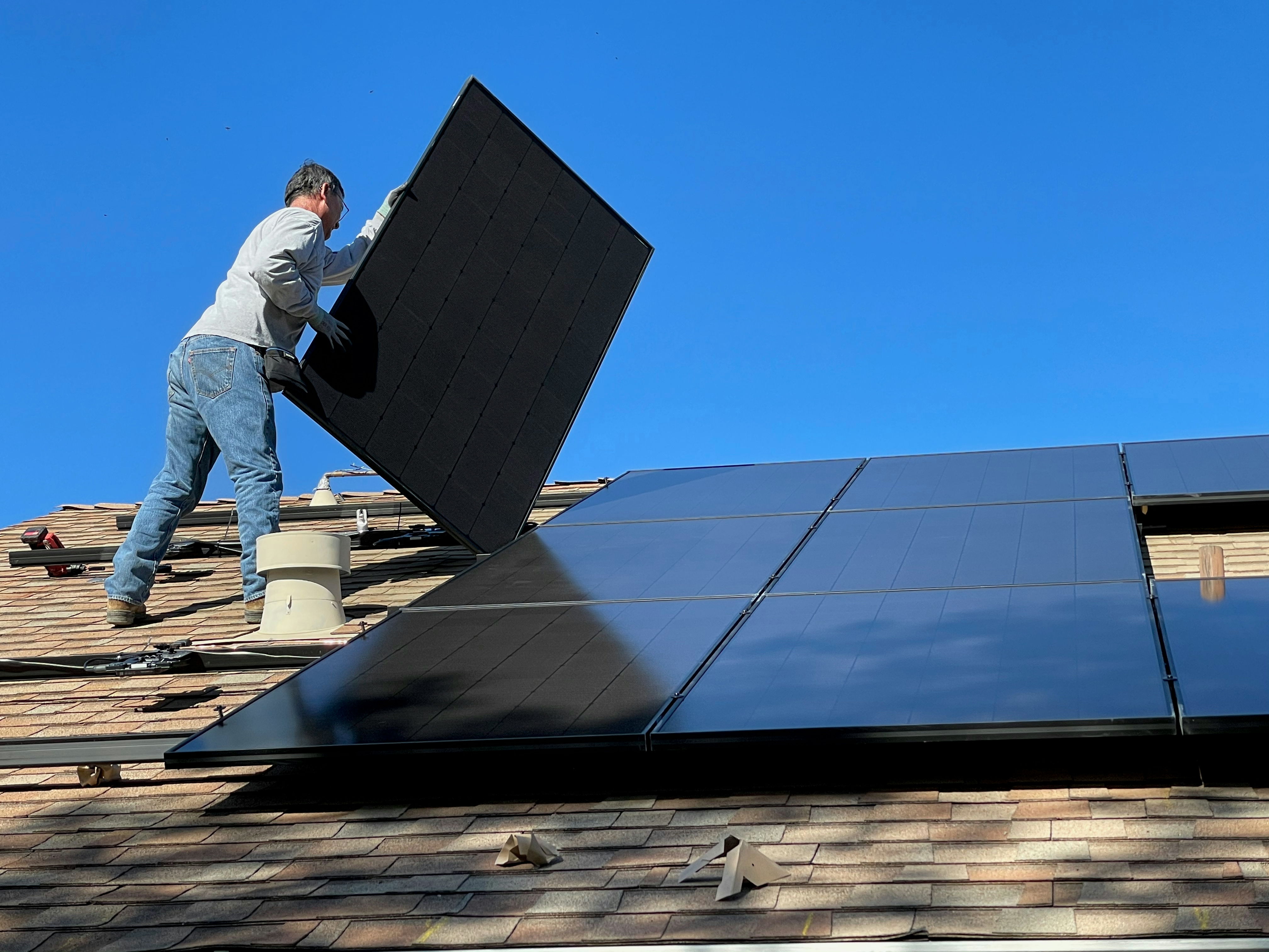 Commercial solar panels on office building rooftop